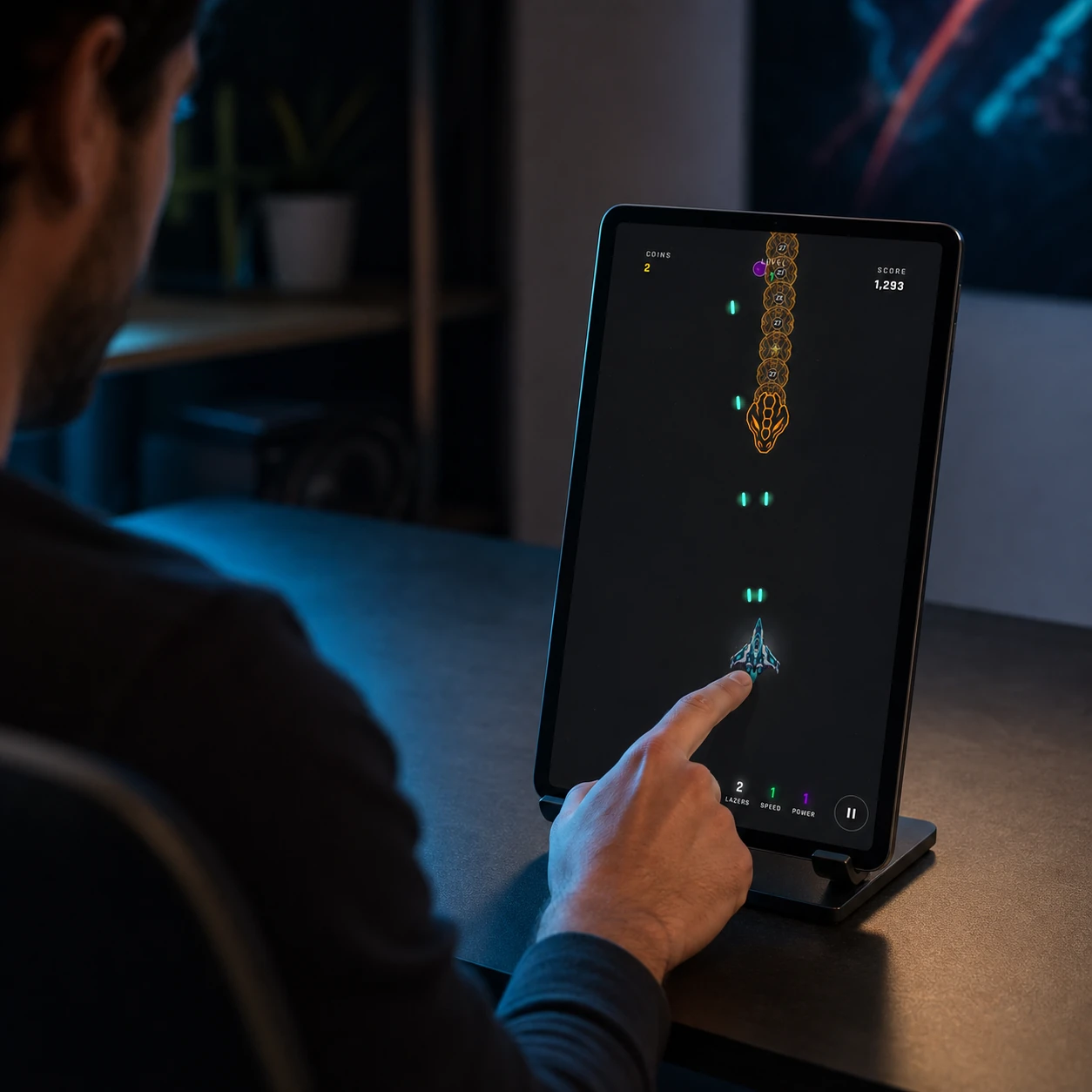 Starfang serpent battle displayed on a portrait tablet at a game studio desk